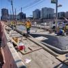 Photo of crews building the sidewalk boarding island at 5th Street - October 2019