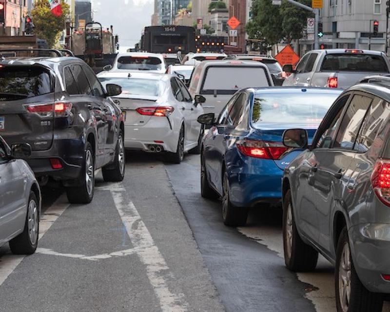 Cars merging in downtown traffic